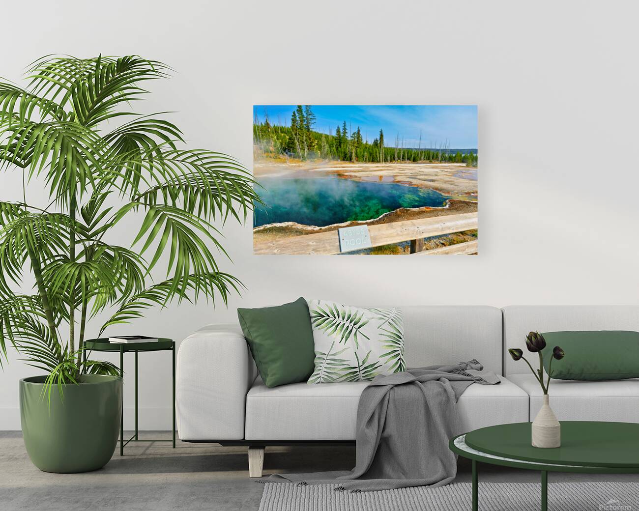 Tourists can see the deep blue Abyss Pool in Yellowstone National Park with steam rising from the hot springs during the warm afternoon. Reproduction