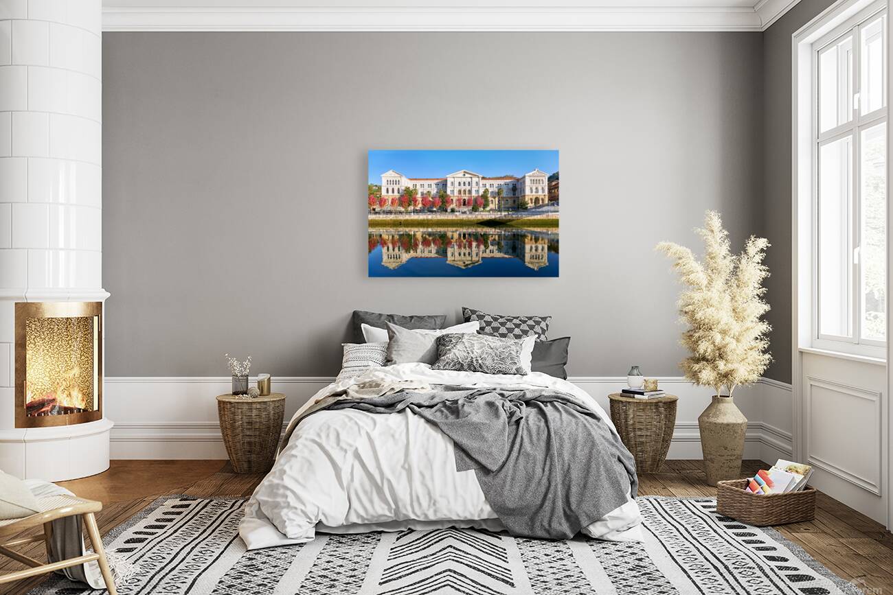 University building reflects in water in Bilbao Spain Reproduction