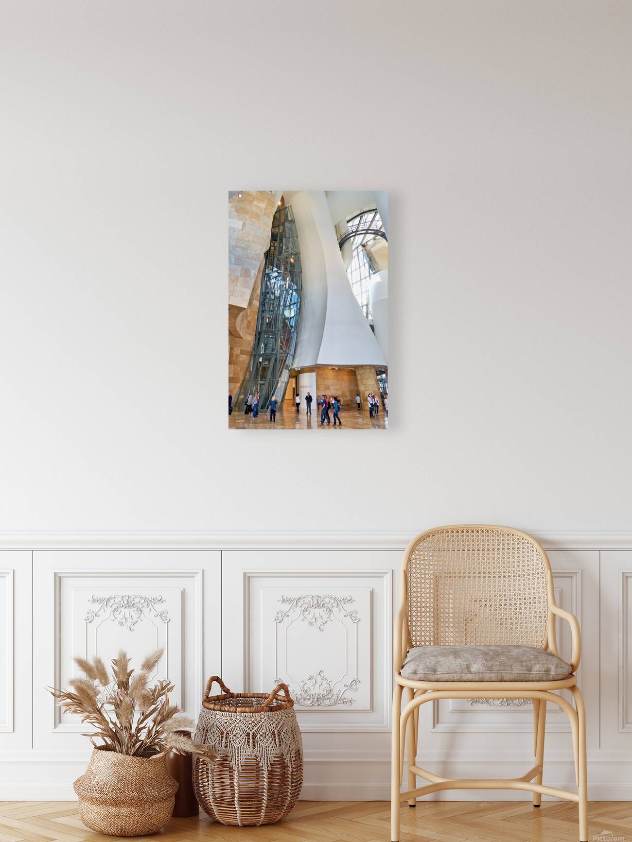 Visitors explore the interior of the Guggenheim Museum in Bilbao Reproduction