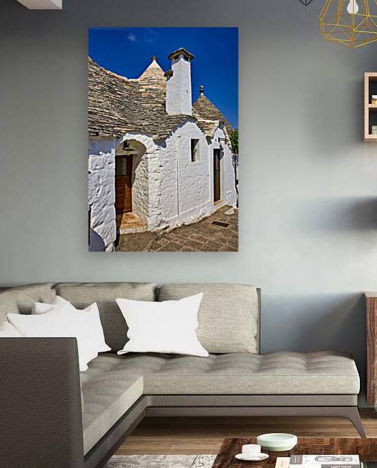 Apulia Puglia Italy. Alberobello. Trulli: traditional Apulian dry stone huts with a conical roof. by Marco Brivio