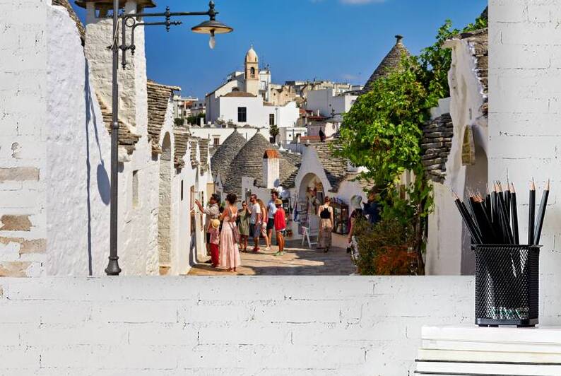 Apulia Puglia Italy. Alberobello. Trulli: traditional Apulian dry stone huts with a conical roof. by Marco Brivio