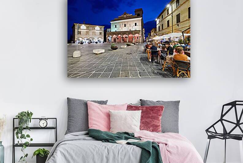 Montefalco Umbria Italy. Piazza del Comune at sunset. People eating out by Marco Brivio