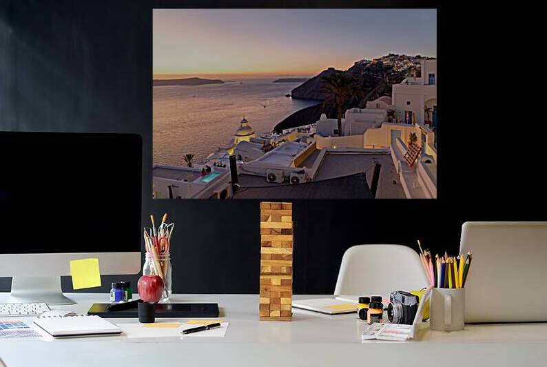 Scenic Santorini sunset white buildings overlooking the caldera by Marco Brivio