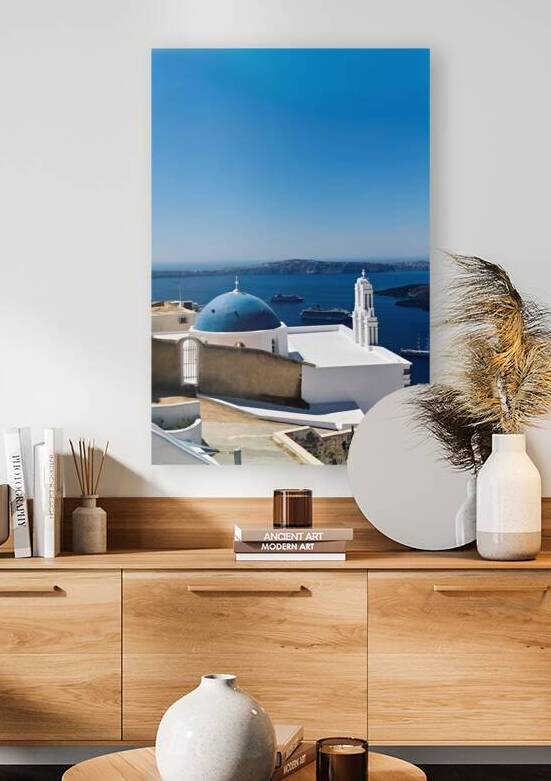 Santorinis blue domed church and bell tower overlooking the Aeg by Marco Brivio