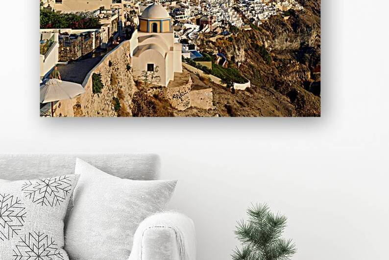 Santorini cliffside town with white buildings overlooking the Ae by Marco Brivio