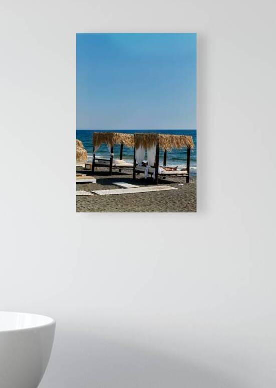 Person relaxing in a beach cabana by the sea. by Marco Brivio