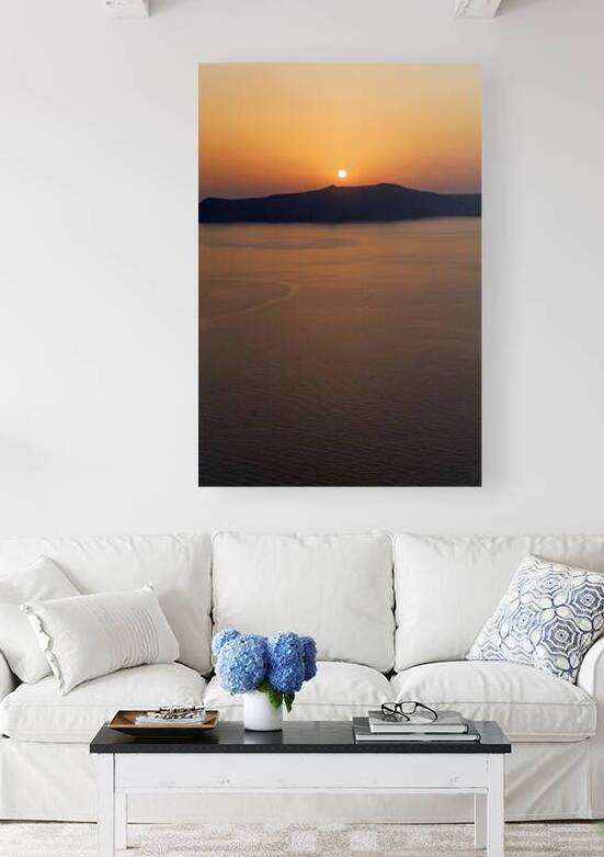 Golden sunset over ocean with silhouetted island. by Marco Brivio