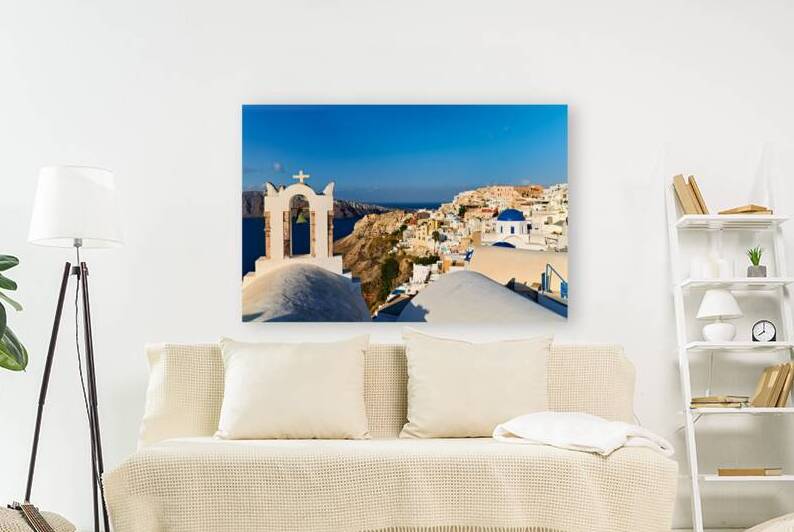 Santorini village with church bell tower overlooking caldera. by Marco Brivio