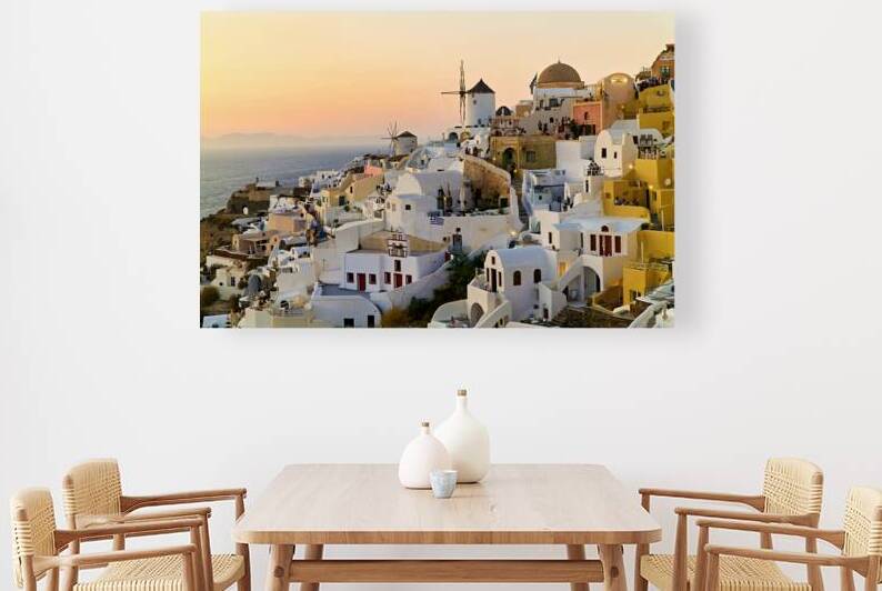 Whitewashed Santorini village and windmills at sunset over the s by Marco Brivio