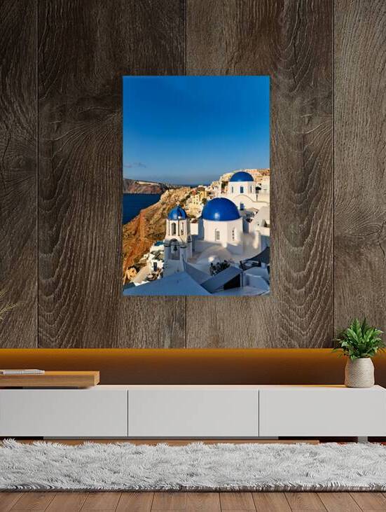 Iconic blue domed churches and white buildings in Santorini Gre by Marco Brivio
