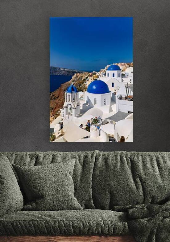 Santorinis iconic blue domes and white architecture overlooking by Marco Brivio
