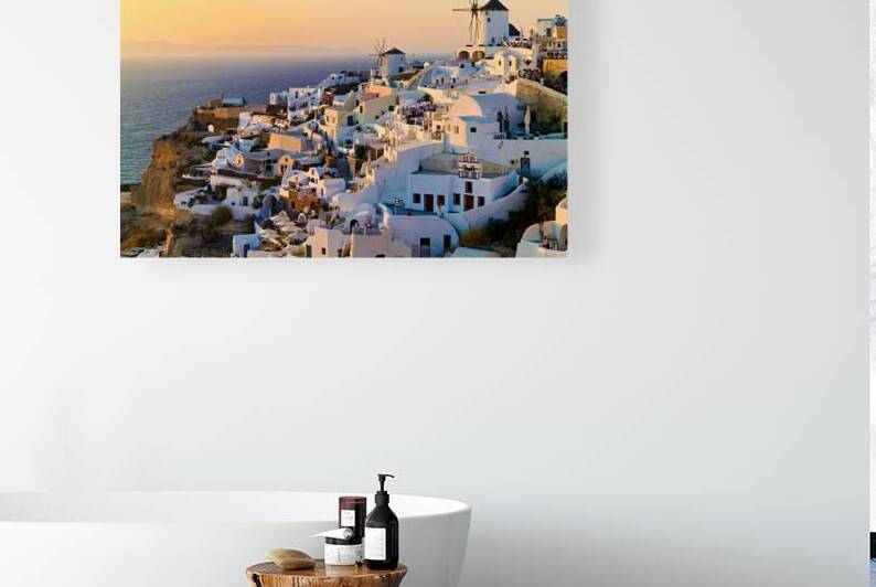 Santorini village at sunset with windmills overlooking the Aegea by Marco Brivio