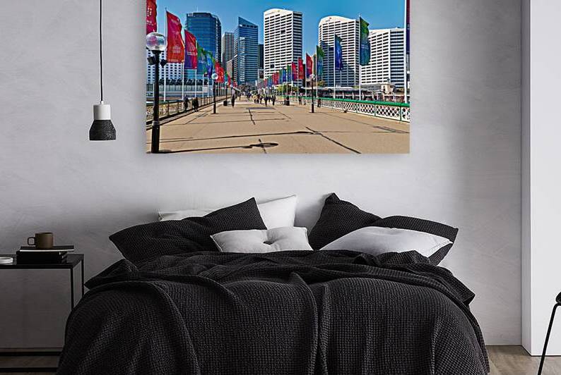 Darling Harbour promenade with flags and city skyline. by Marco Brivio