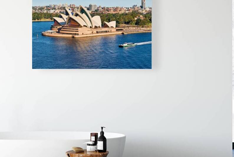 Sydney Opera House and harbor with ferry boat. by Marco Brivio