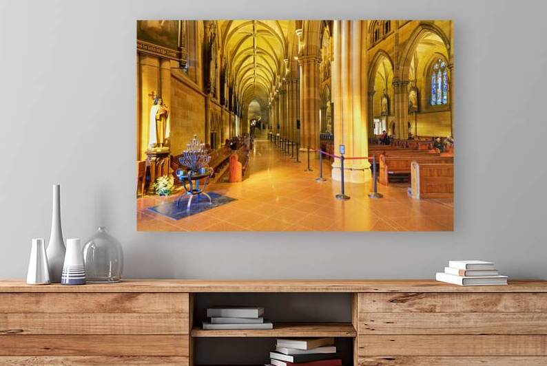 Interior of a grand cathedral with pews and stained glass. by Marco Brivio