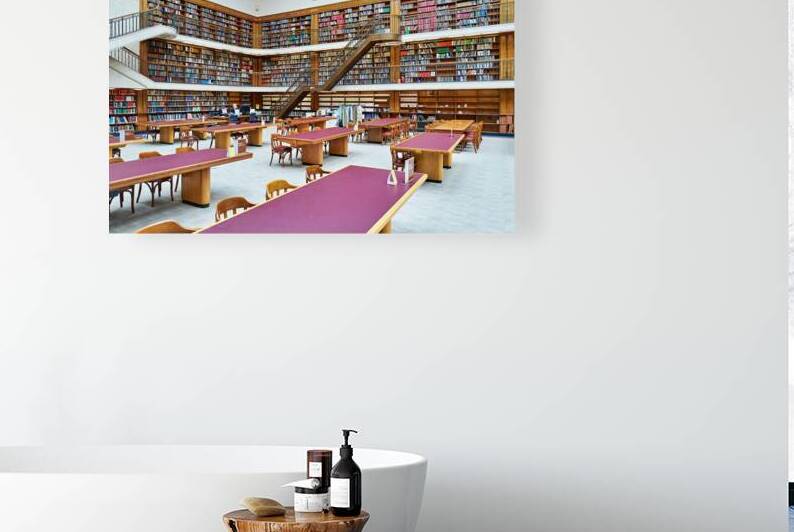 Grand library in Sydney with tall bookshelves and study areas by Marco Brivio