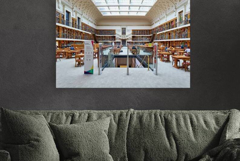 Spacious library with ornate ceiling books and people studying by Marco Brivio