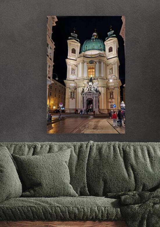 Illuminated baroque church at night with people on a wet street. by Marco Brivio