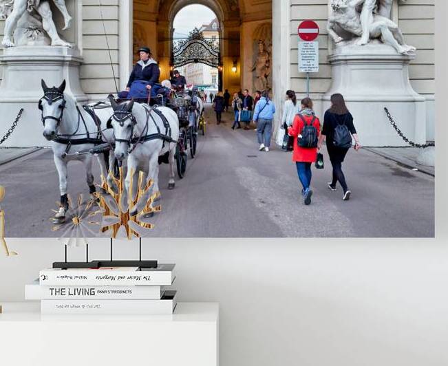 Historic archway with statues horse carriage and pedestrians. by Marco Brivio