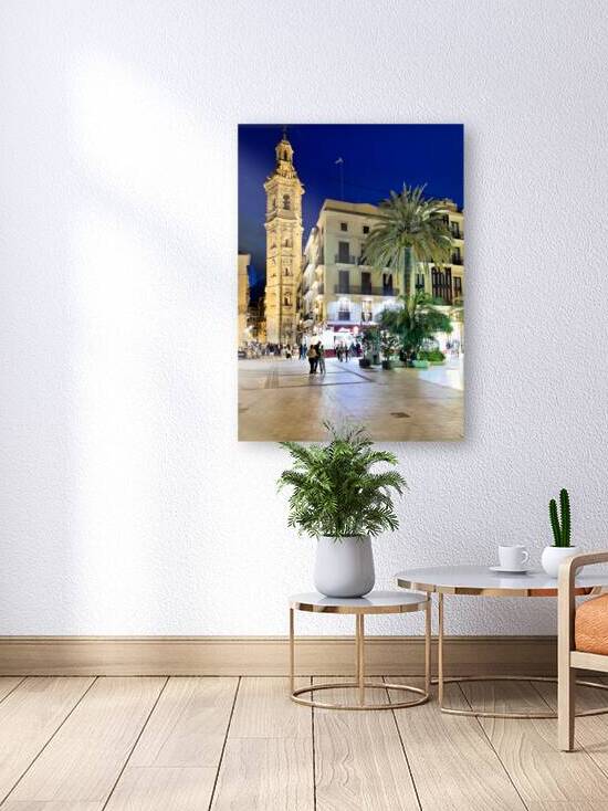 Santa Catalina Church in Valencia Spain at night with people wal by Marco Brivio