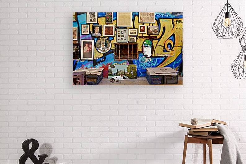 Flea market scene in Monastiraki Athens with colorful wall art by Marco Brivio