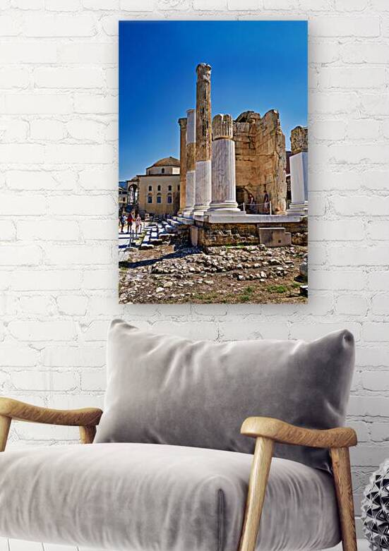 Visitors explore Hadrians Library in Athens Greece on a sunny d by Marco Brivio