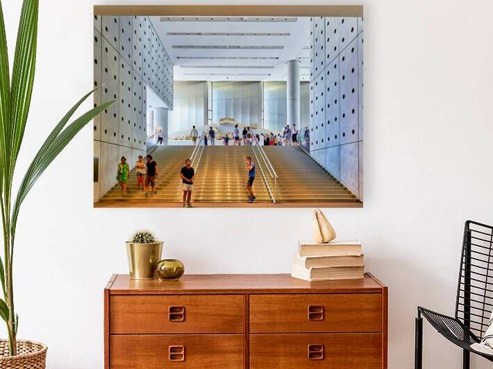 People walk around the Acropolis Museum in Athens Greece by Marco Brivio