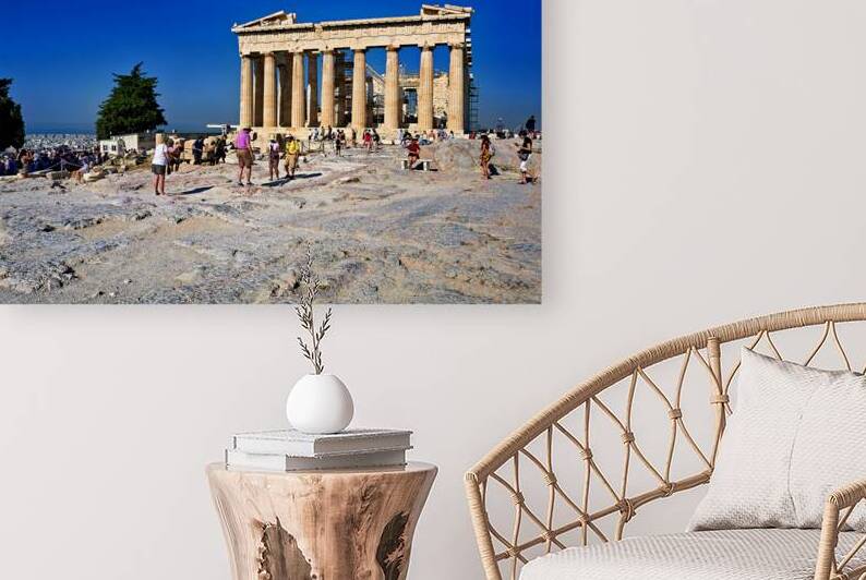 Visitors explore the Parthenon at the Acropolis in Athens Greece by Marco Brivio