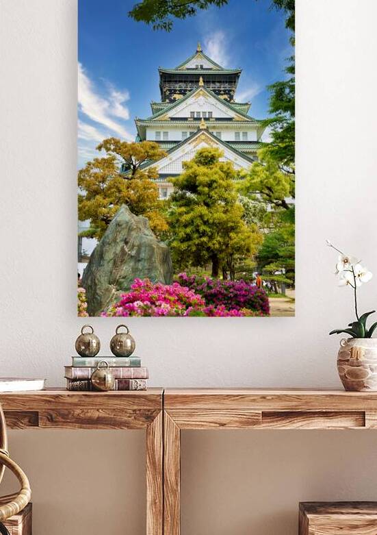 View of Osaka Castle among trees and flowers in Japan by Marco Brivio
