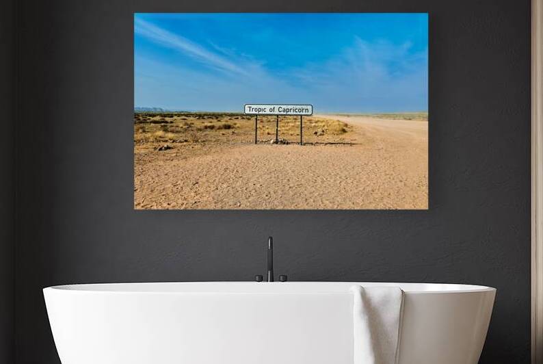 Driving on a dirt road at the Tropic of Capricorn in Namibia by Marco Brivio
