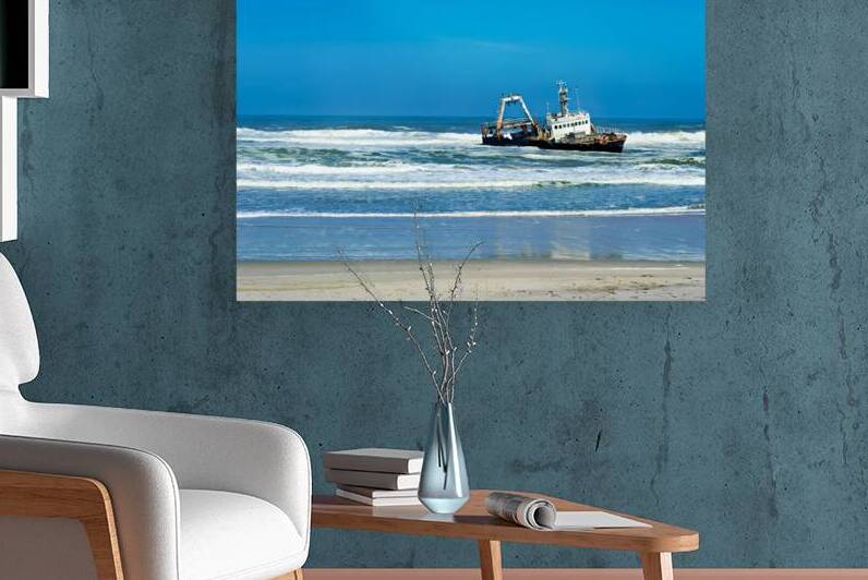 Shipwreck on the Skeleton Coast of Namibia under clear blue sky by Marco Brivio