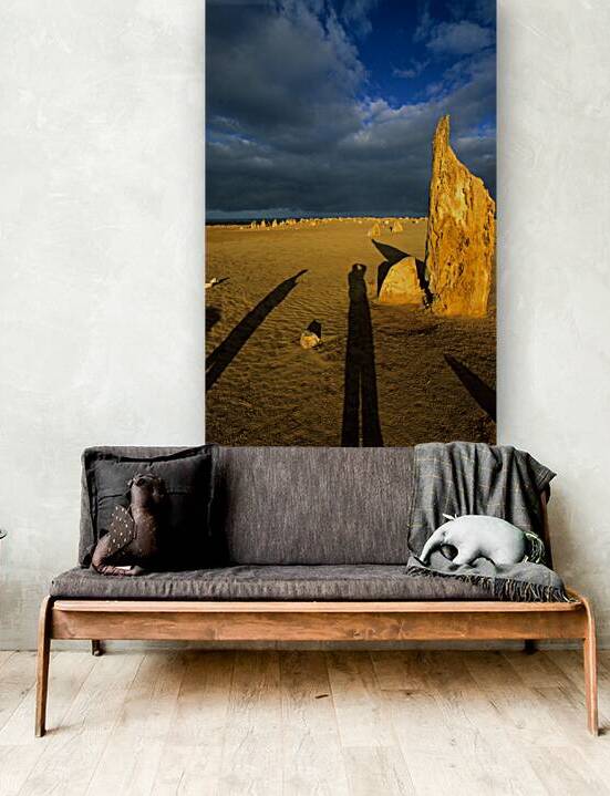 Photographers shadow falls on the Pinnacles desert at sunset. by Marco Brivio