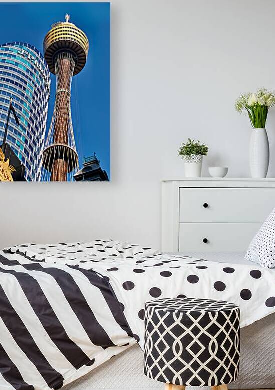 Sydney Tower and J.P. Morgan building against blue sky. by Marco Brivio