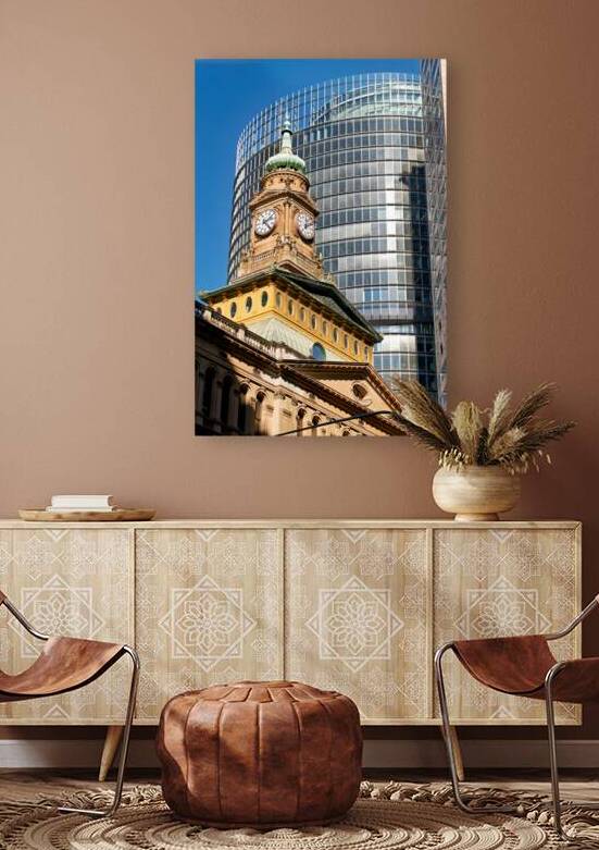 Historic clock tower contrasts with modern glass skyscraper. by Marco Brivio