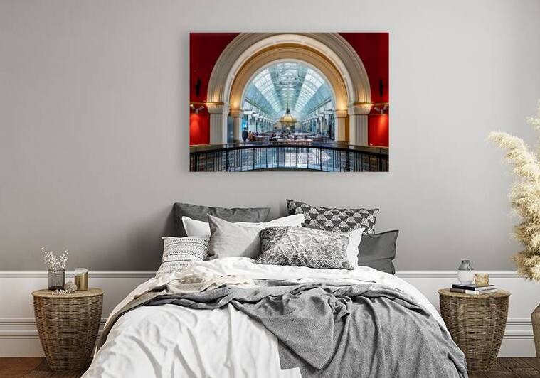 Elegant interior of a shopping arcade with people dining. by Marco Brivio