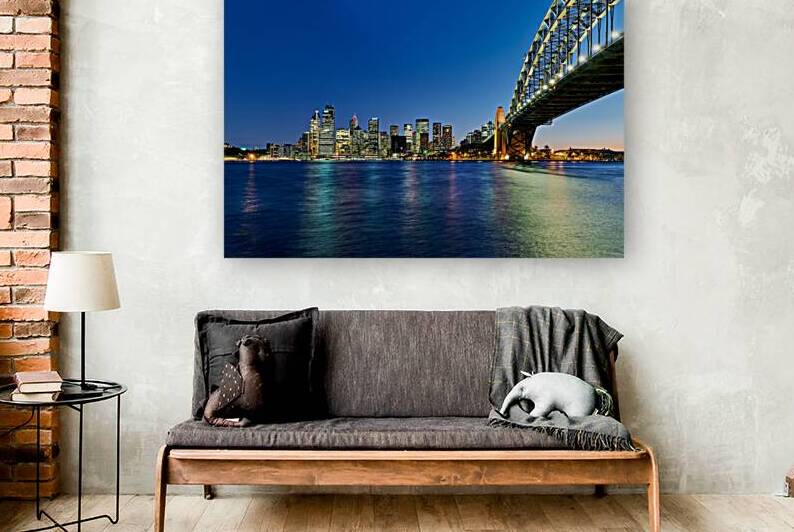 Sydney Harbour Bridge and city skyline at dusk. by Marco Brivio
