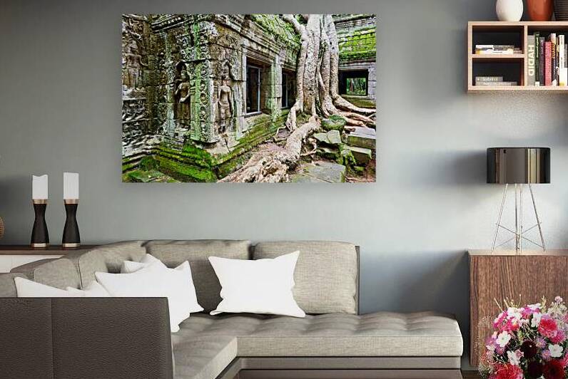 Ancient temple ruins overgrown with moss and massive tree roots by Marco Brivio