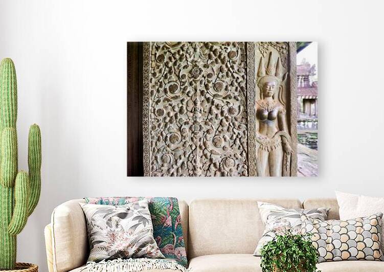 Intricate stone carvings of a deity and patterns at an ancient t by Marco Brivio