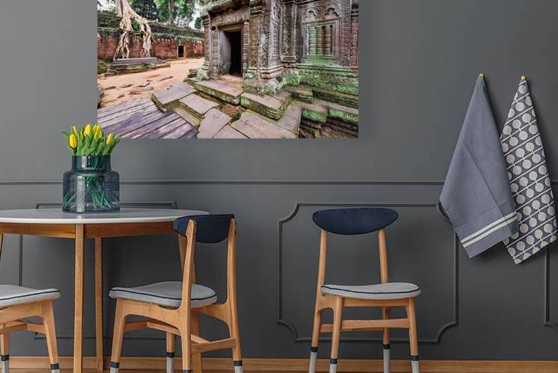 Angkor temple ruins consumed by nature. by Marco Brivio