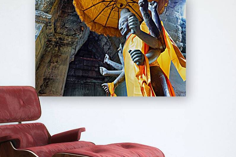 Ancient multi armed statue yellow fabric inside stone temple. by Marco Brivio