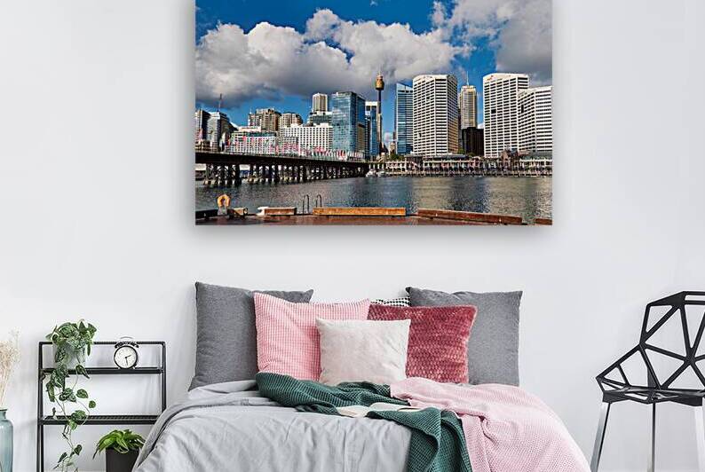 Sydney Harbour skyline with bridge and buildings under clouds. by Marco Brivio