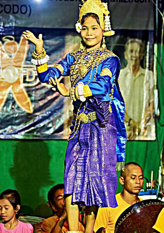 Young girl performs traditional Cambodian dance in ornate costum by Marco Brivio