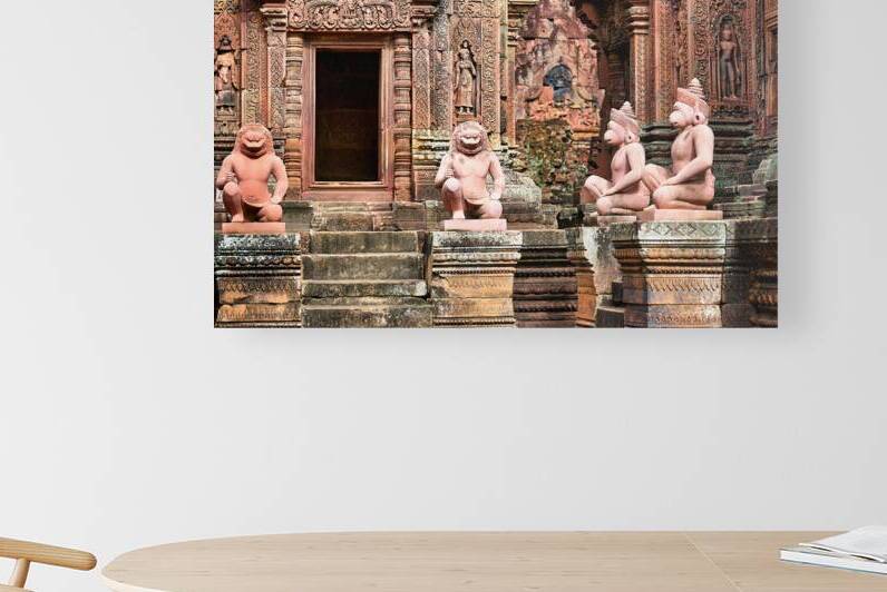Ancient Cambodian temple with intricate red sandstone carvings a by Marco Brivio
