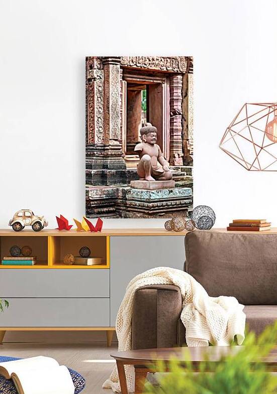 Ancient Khmer temple with detailed carvings and a stone guardian by Marco Brivio