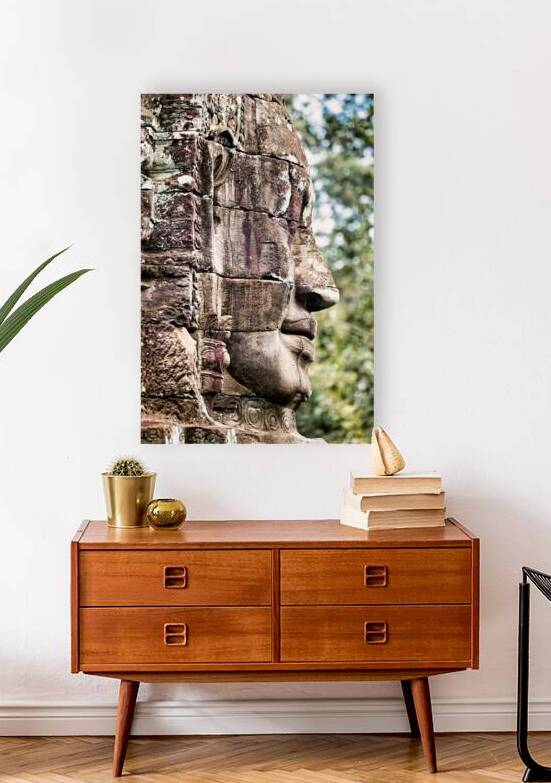 Weathered stone face carving from an ancient temple. by Marco Brivio