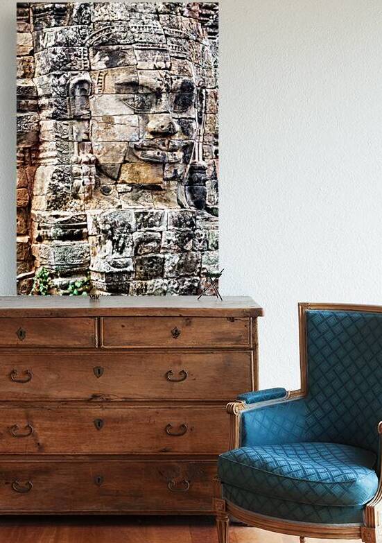 Ancient stone face carved into temple wall. by Marco Brivio