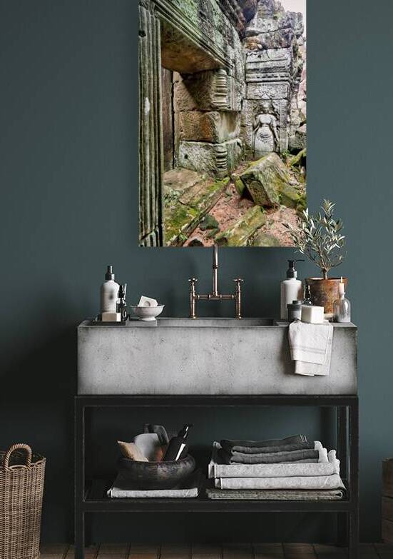 Ancient temple ruins with carved stone deity and moss. by Marco Brivio