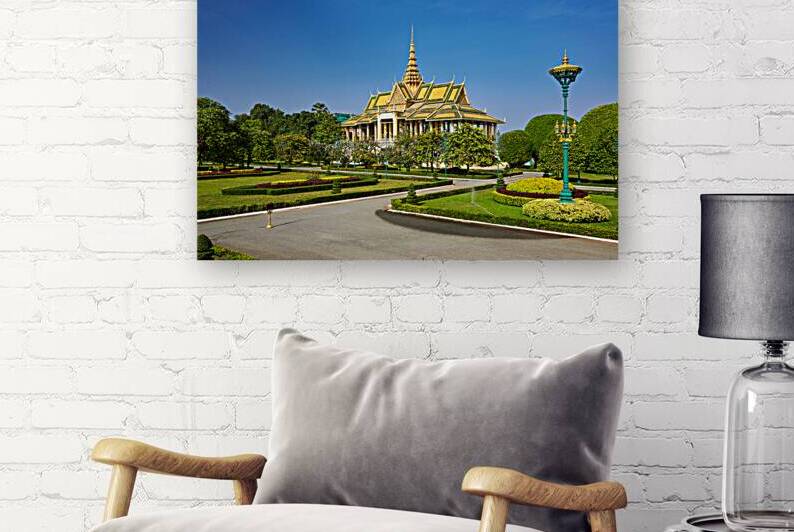 Golden roofed palace in lush gardens Phnom Penh Cambodia. by Marco Brivio