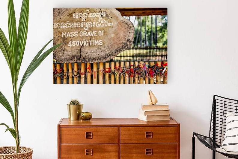 Sign for mass grave of 450 victims with memorial bracelets. by Marco Brivio