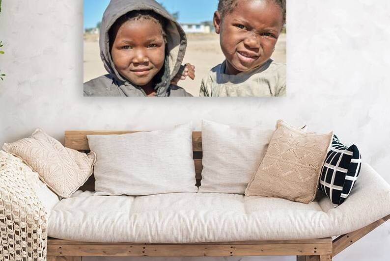 Children in Damaraland village of Namibia share a moment togethe by Marco Brivio